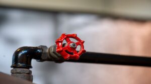 Closeup shot of a Bright red industrial valve